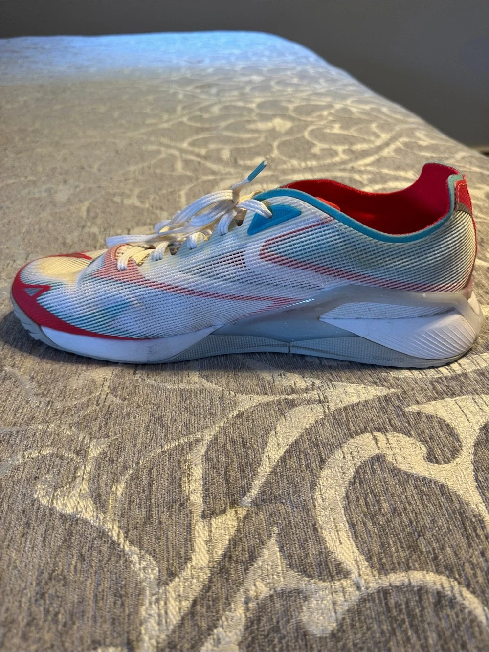 Reebok Nano Froning X2 Men’s White Athletic Sneakers with Red and Blue Accents